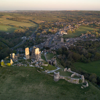 Sun setting over Corfe Castle, looking along the village