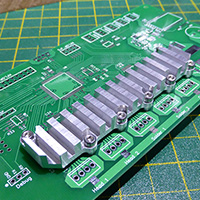 Click to view large image of Checking the heatsink fit on a spare PCB